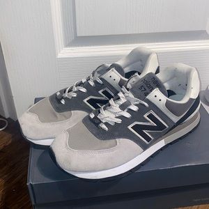 Black and grey New Balance 574s